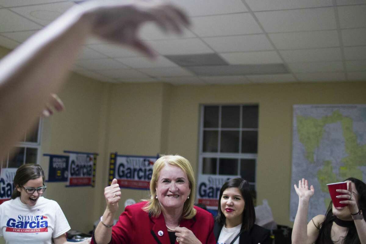 Sylvia Garcia, 67, candidate for U.S. Representative District 29 dances with her friends and supporters after winning the primary elections, Tuesday, March 6, 2018, in Houston. ( Marie D. De Jesus / Houston Chronicle )