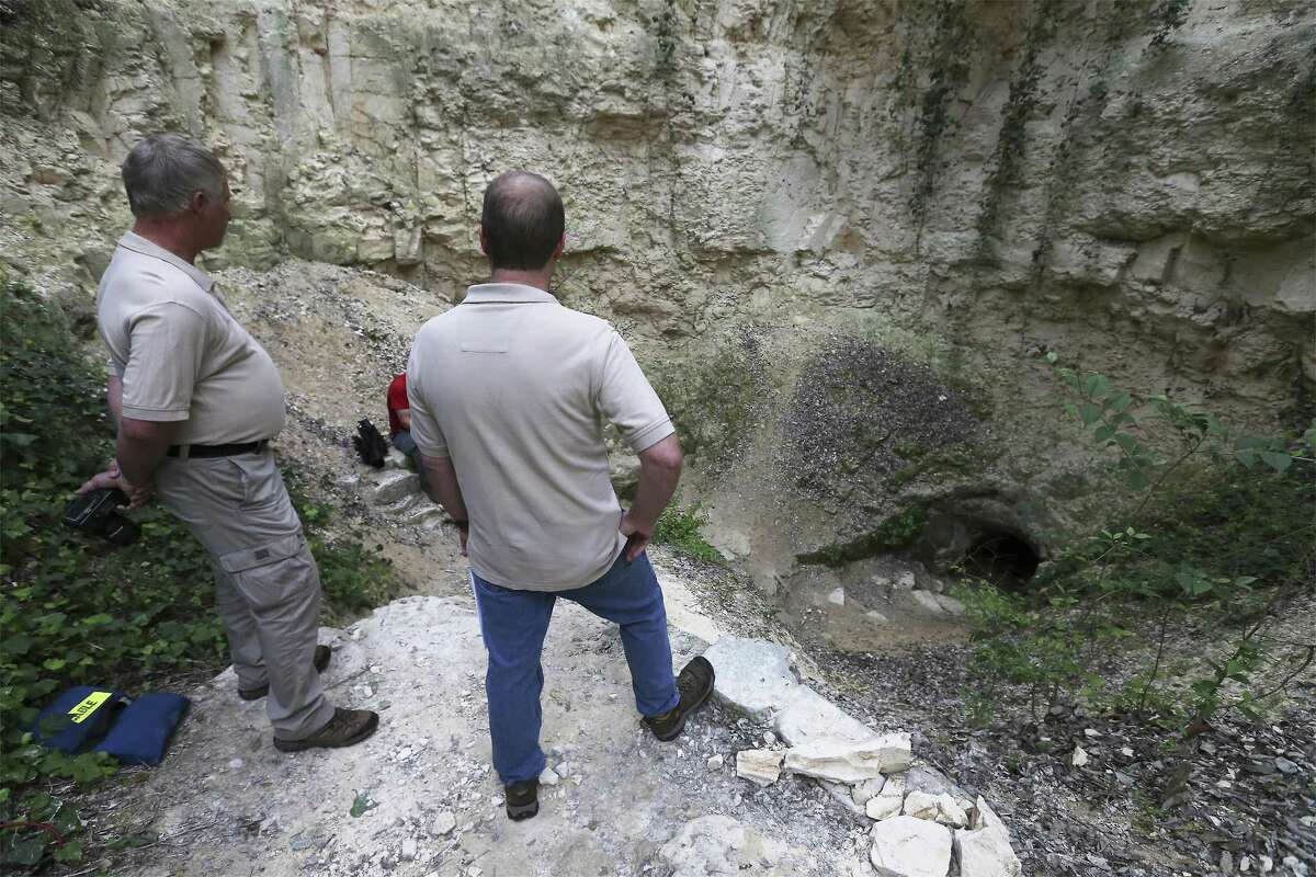 Michael Harris (left) and Joe Mitchell of Cave Management Association of Texas overlooks the entrances to Robber Baron Cave. A high school student was finally freed just before midnight after spending about 11 hours stuck in a narrow passageway in Robber Baron Cave on the North Side. The Texas Cave Management Association, which owns the cave and offers guided tours, spoke to media in a press conference on Friday, Mar. 9, 2018. (Kin Man Hui/San Antonio Express-News)