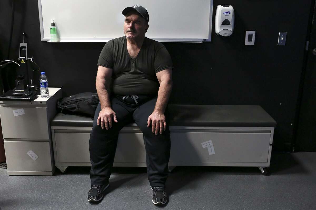 David Colbath rests after practicing his shooting using an active shooter simulation for the first time in the Firearms Training Simulator at the Center for the Intrepid.