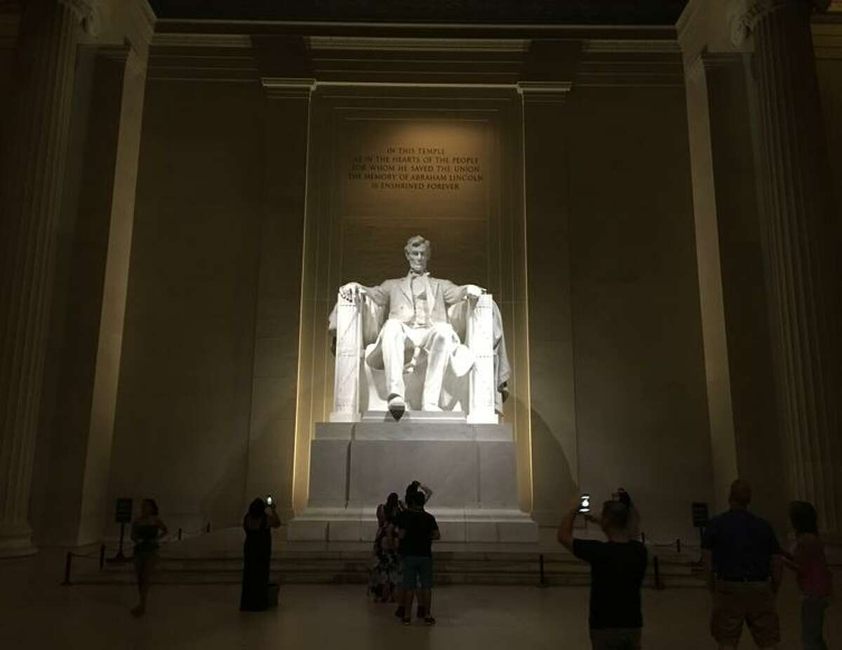 Tourists visit the Lincoln Memorial in Washington, D.C., an example of how well-kempt the city is.