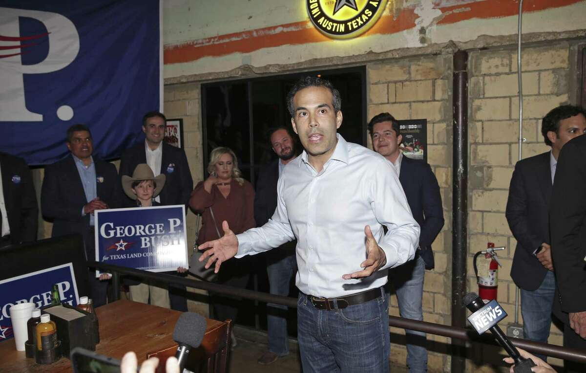 George P. Bush walks in the door at Stiles Switch BBQ to loud applause Tuesday at his election night watch party in Austin.