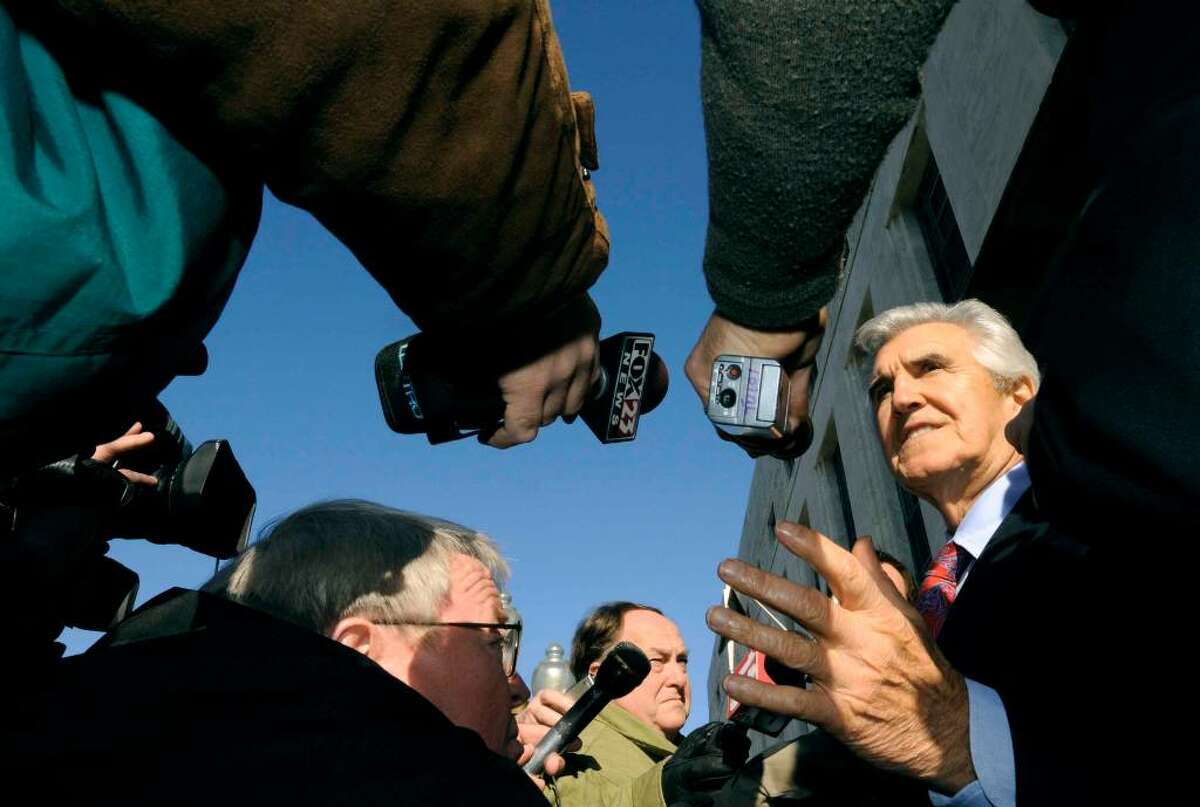 Former state Sen. Joseph Bruno , right, speaks to the media outside the federal court house during a break in his 2009 trial in Albany. (Michael P. Farrell/ Times Union)