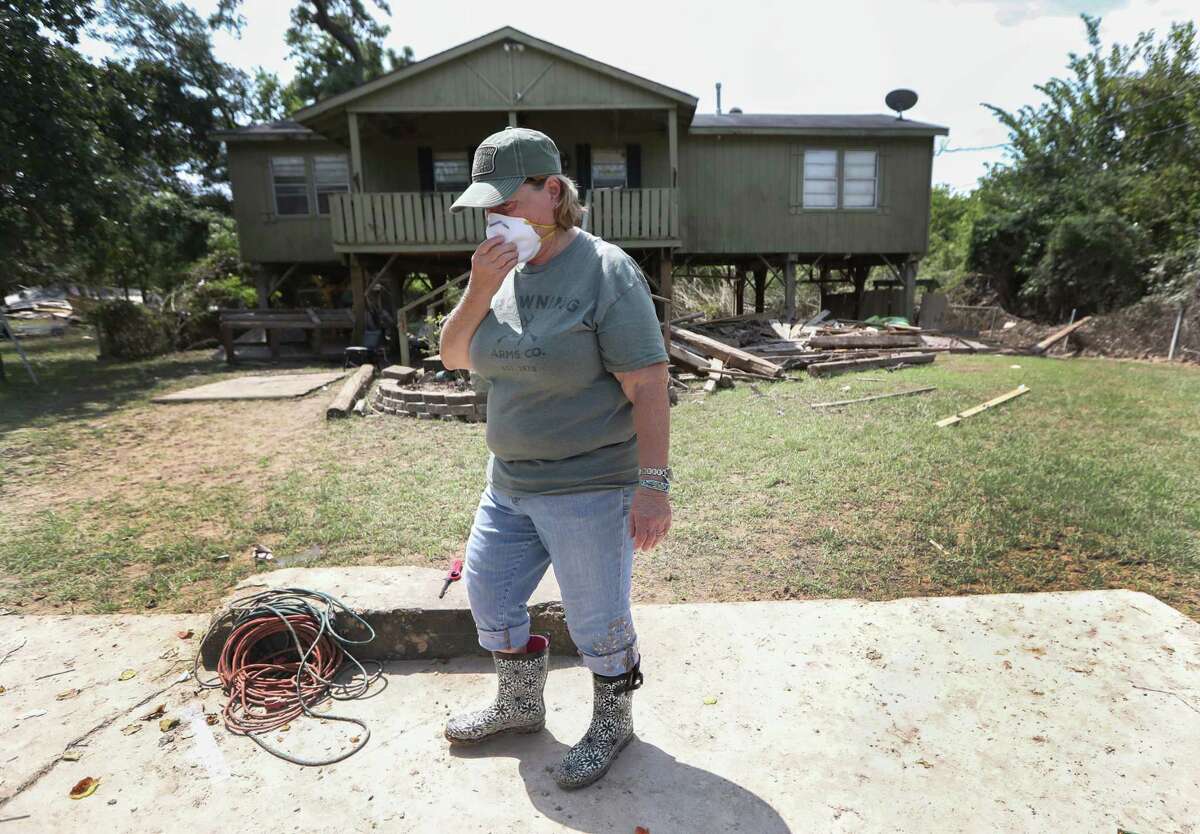Jennifer Harpster at her Cannelview home near a toxic waste pit. Harpster worried about toxins in her home after floodwater entered the house, which stood on eight-foot stilts.