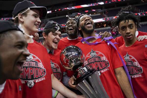 Davidson teammates celebrate after an NCAA college basketball championship game against Rhode Island in the Atlantic 10 Conference tournament, Sunday, March 11, 2018, in Washington. (AP Photo/Andrew Harnik)