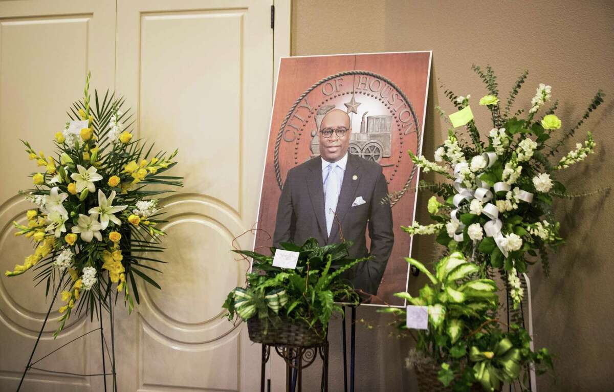 A photograph of Houston City Councilman Larry Green is placed surrounded by flower arrangement gifts at Sugar Land Mortuary, Sunday, March 11, 2018, in Sugar Land. ( Marie D. De Jesus / Houston Chronicle )