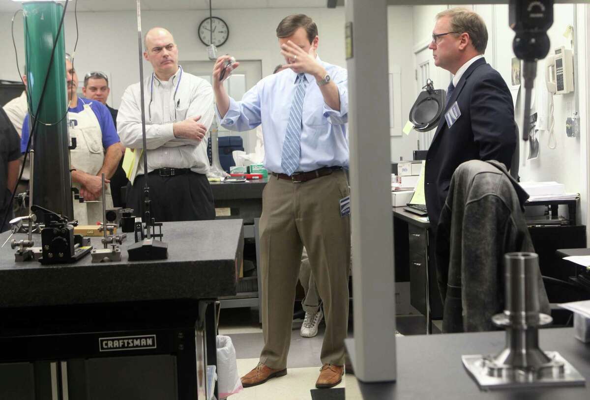 Straton Industries, a machining contractor in Stratford, is among the manufacturers that expanded in 2017. In this 2013 picture, U.S. Sen. Chris Murphy, center, and then-Stratford Mayor John Harkins, right, visited Straton. David Cremin, the Straton president, is at left.
