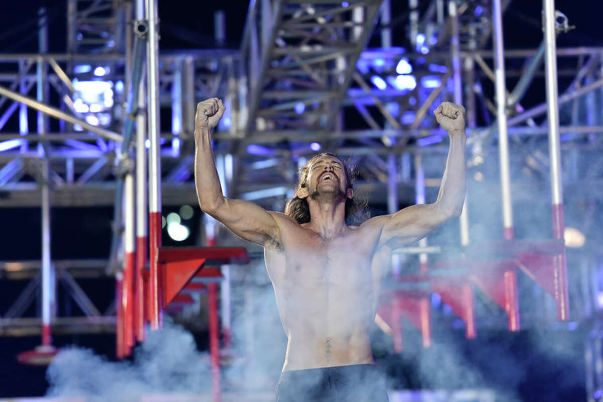 Isaac Caldiero celebrates after his stage 3 victory in NBC's "American Ninja Warrior."