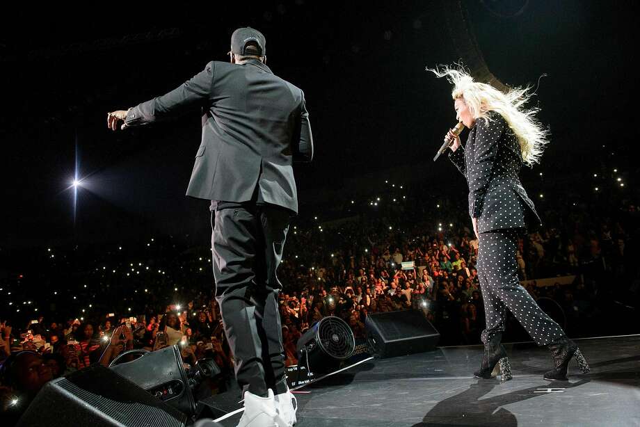 (FILES) In this file photo taken on November 4, 2016 Beyonce (L) and Jay Z perform during a Get Out the Vote (GOTV) performance in support of Democratic presidential nominee Hillary Clinton at the Wolstein Center in Cleveland, Ohio. Music's first couple Beyonce and Jay-Z on March 12, 2018 announced a new joint tour in what will likely mark some of the year's most lucrative concerts.The rapper and diva, who in June gave birth to twins, will open the stadium tour on June 6 in the Welsh city of Cardiff.The 36-date show will travel across Europe, including a Bastille Day show at the Stade de France in Paris, before a North American leg that closes on October 2 in Vancouver.  / AFP PHOTO / Brendan SmialowskiBRENDAN SMIALOWSKI/AFP/Getty Images Photo: BRENDAN SMIALOWSKI, AFP/Getty Images