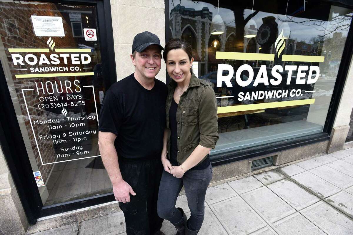 Bill and Kristin Hall, the co-owners of the new Roasted Sandwich Co., at 148 Bedford St., in Stamford, Conn., gather in front of the eatery on Thursday, March 8, 2018.