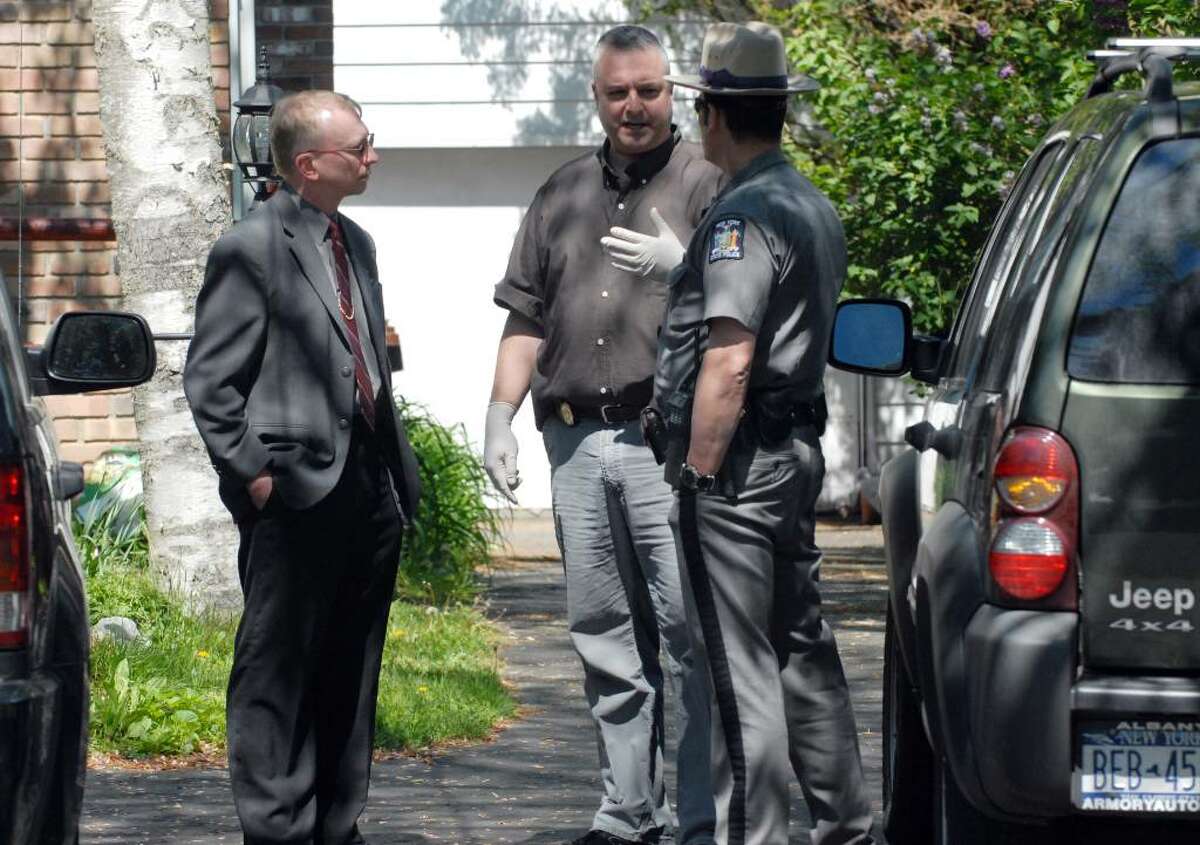 State Police investigate the scene at the home of Gary Veeder, a longtime forensic scientist for the New York State Police, who committed suicide at his home in Voorheesville in 2008. (WILL WALDRON / TIMES UNION )