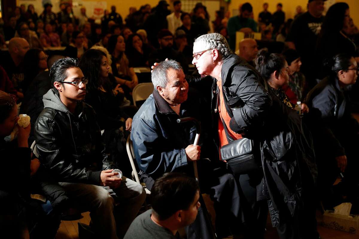 Gina Padilla hugs Jose Delgado, the father of Jesus Adolfo Delgado Duarte during a townhall meeting with police to update the community on the investigation of the police involved shooting of Delgado Duarte at Cesar Chavez School in San Francisco, Calif., on Monday, March 12, 2018.