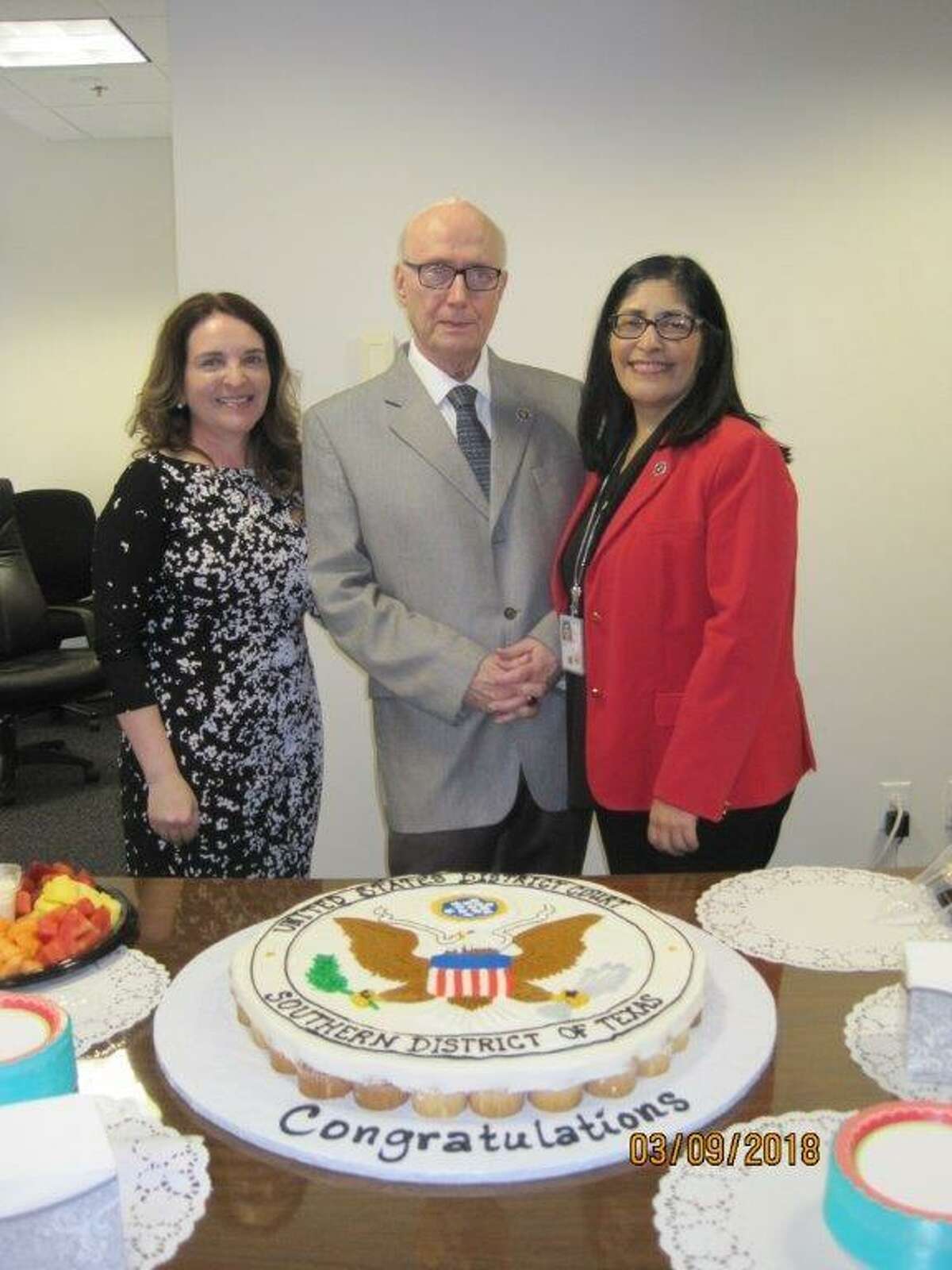 U.S. district judges Marina Garcia Marmolejo, left, and Diana Saldaña pose for a photo with Senior U.S. District Court Judge George P. Kazen at his retirement party on Friday.