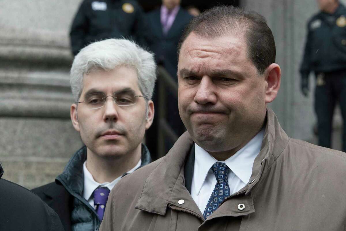 Joseph Percoco, right, former top aide to New York Gov. Andrew Cuomo, reacts while talking to reporters outside U.S. District court, Tuesday, March 13, 2018, in New York. Percoco was convicted on corruption charges Tuesday at a trial that further exposed the state capital's culture of backroom deal-making.