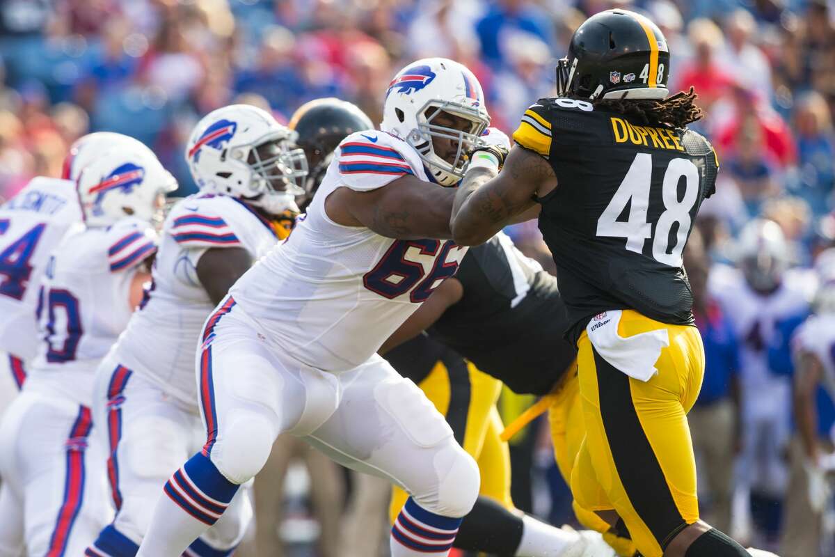 ORCHARD PARK, NY - AUGUST 29: Seantrel Henderson #66 of the Buffalo Bills tries to stop Bud Dupree #48 of the Pittsburgh Steelers during a preseason game on August 29, 2015 at Ralph Wilson Stadium in Orchard Park, New York. Buffalo defeats Pittsburgh 43-19. (Photo by Brett Carlsen/Getty Images)