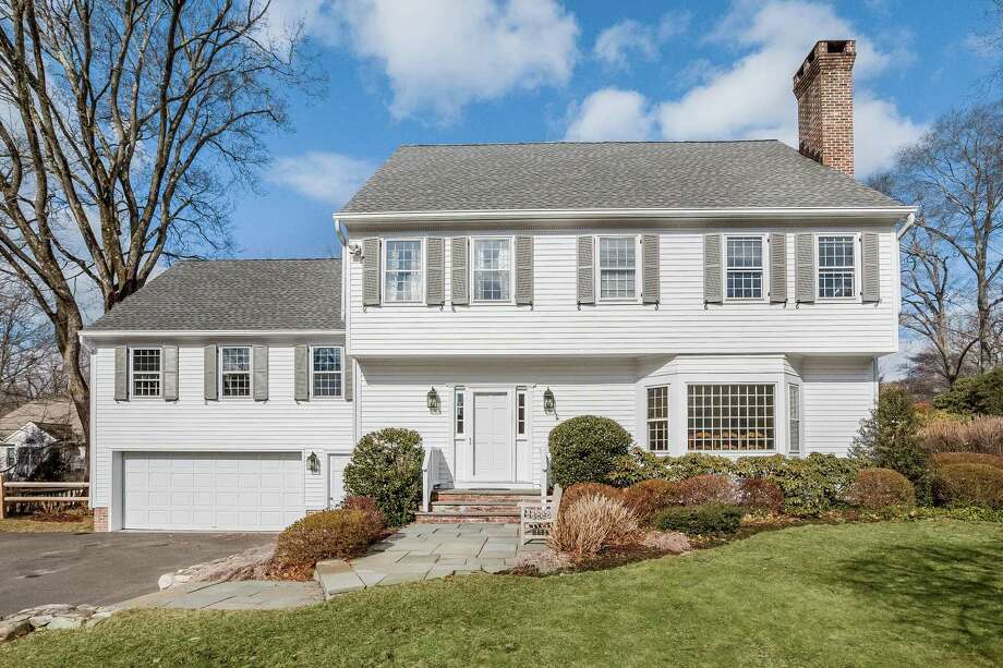 The pale gray Garrison colonial at 9 Colony Road is only steps away from Woodland Park Nature Preserve. Photo: PlanOmatic / © 2017 PlanOmatic