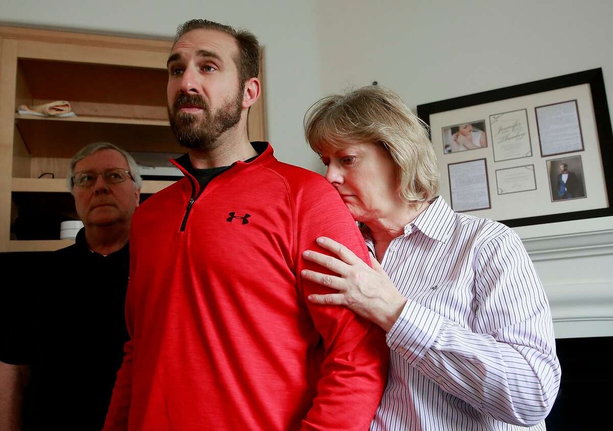 T.J. Shushereba, center, with his parents Ted, left, and Debbie talks about his wife Jennifer Gonzales at their home in Napa. Gonzales was was killed by a gunman inside the Yountville Pathways home, where she worked as a psychologist, last Friday.