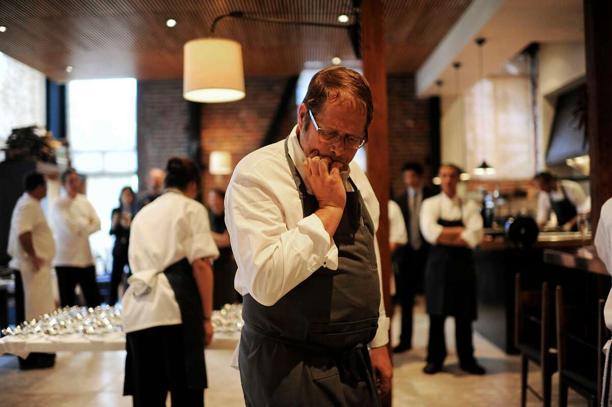 Chef David Kinch, center, checks his course before it gets served in the kitchen of Quince on Sunday, July 29, 2012 in San Francisco, Calif.