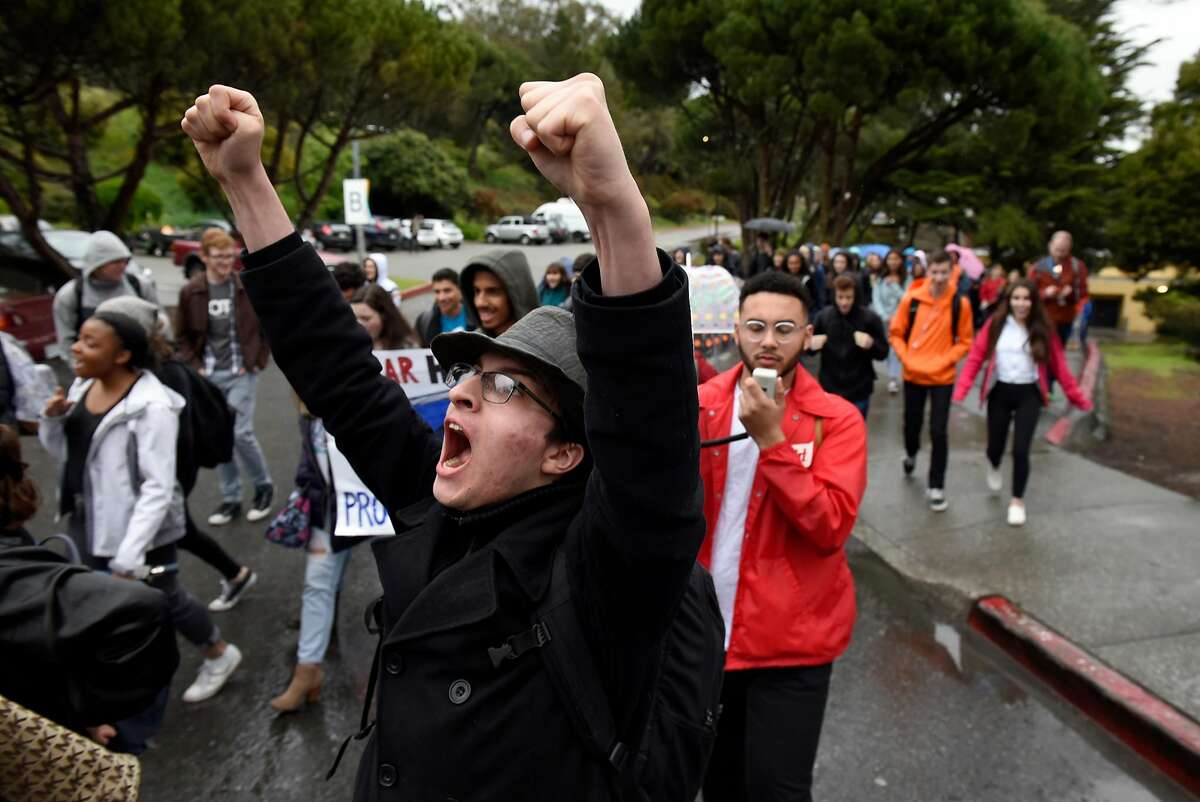 Students march out of the Ruth Asawa School of the Arts on their way to City Hall in San Francisco, Calif., on Wednesday March 14, 2018. Students across the country participate in a national walkout to oppose gun violence.