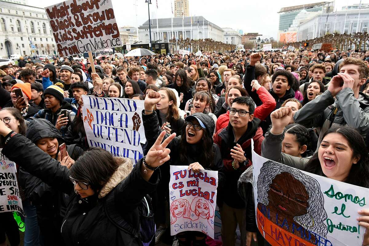 Students cheer as they gather in from of City Hall to oppose gun violence, in San Francisco, Calif., on Wednesday March 14, 2018. Students across the country participate in a national walkout to oppose gun violence.
