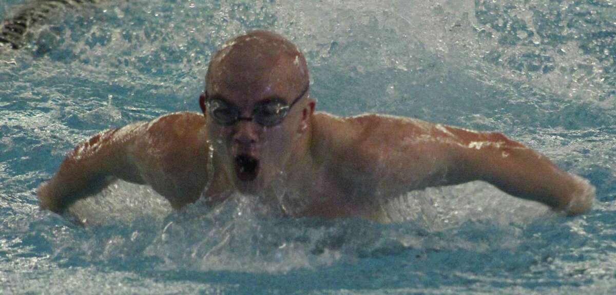 Torrington's Michael Ivain competes in the 100-yard butterfly at the Class M state swimming championships at the Cornerstone Aquatics Center in West Hartford March 14, 2018.