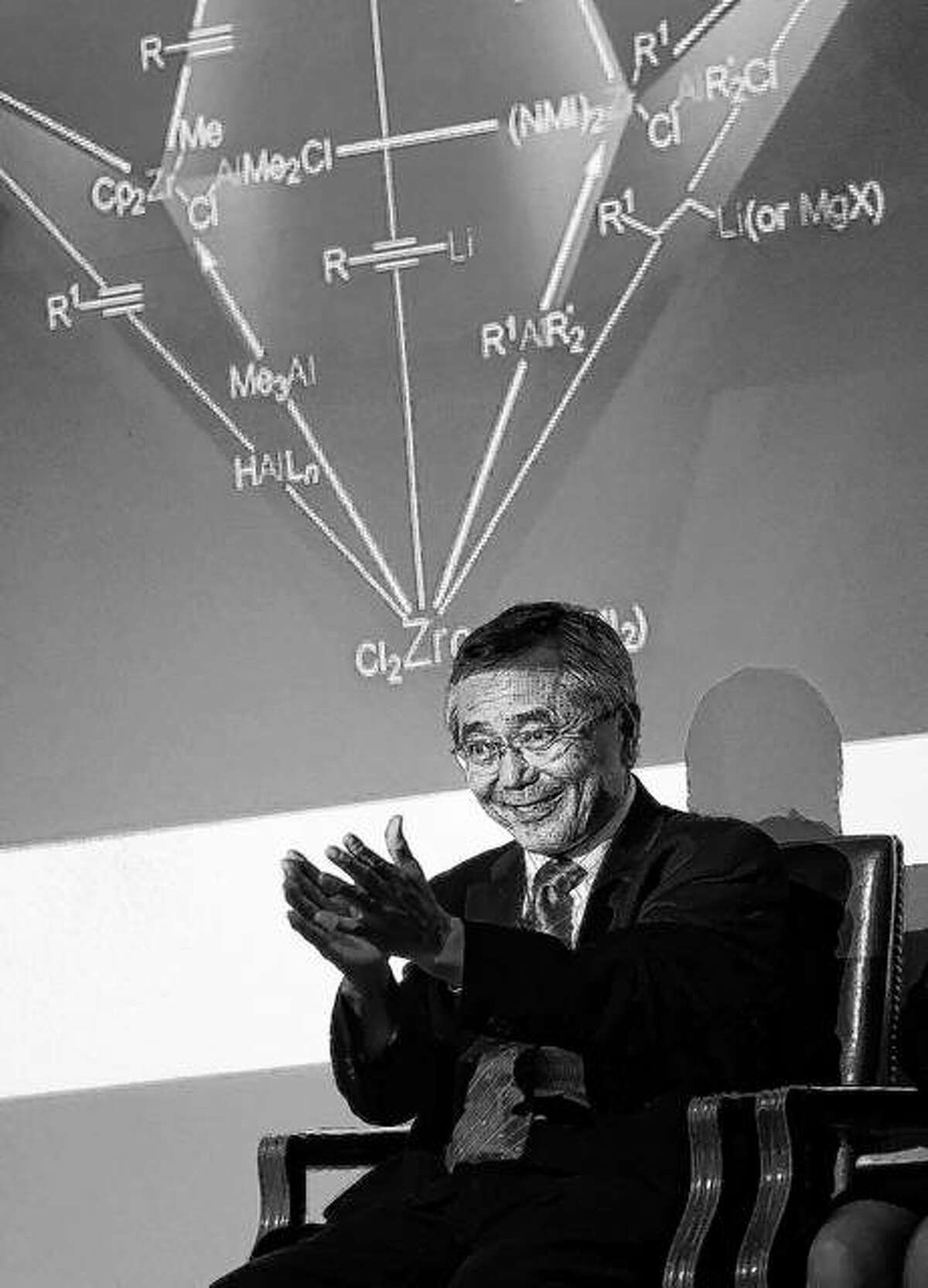 Purdue professor and chemistry Nobel Laureate Ei-ichi Negishi applauds the audience as they applaud him as he is introduced before presenting his talk at Fowler Hall on the campus of Purdue University in West Lafayette, Indiana. Sumire Negishi was found dead Tuesday in a northern Illinois landfill after her 82-year-old husband Ei-ichi was found wandering a road south of Rockford, police said.