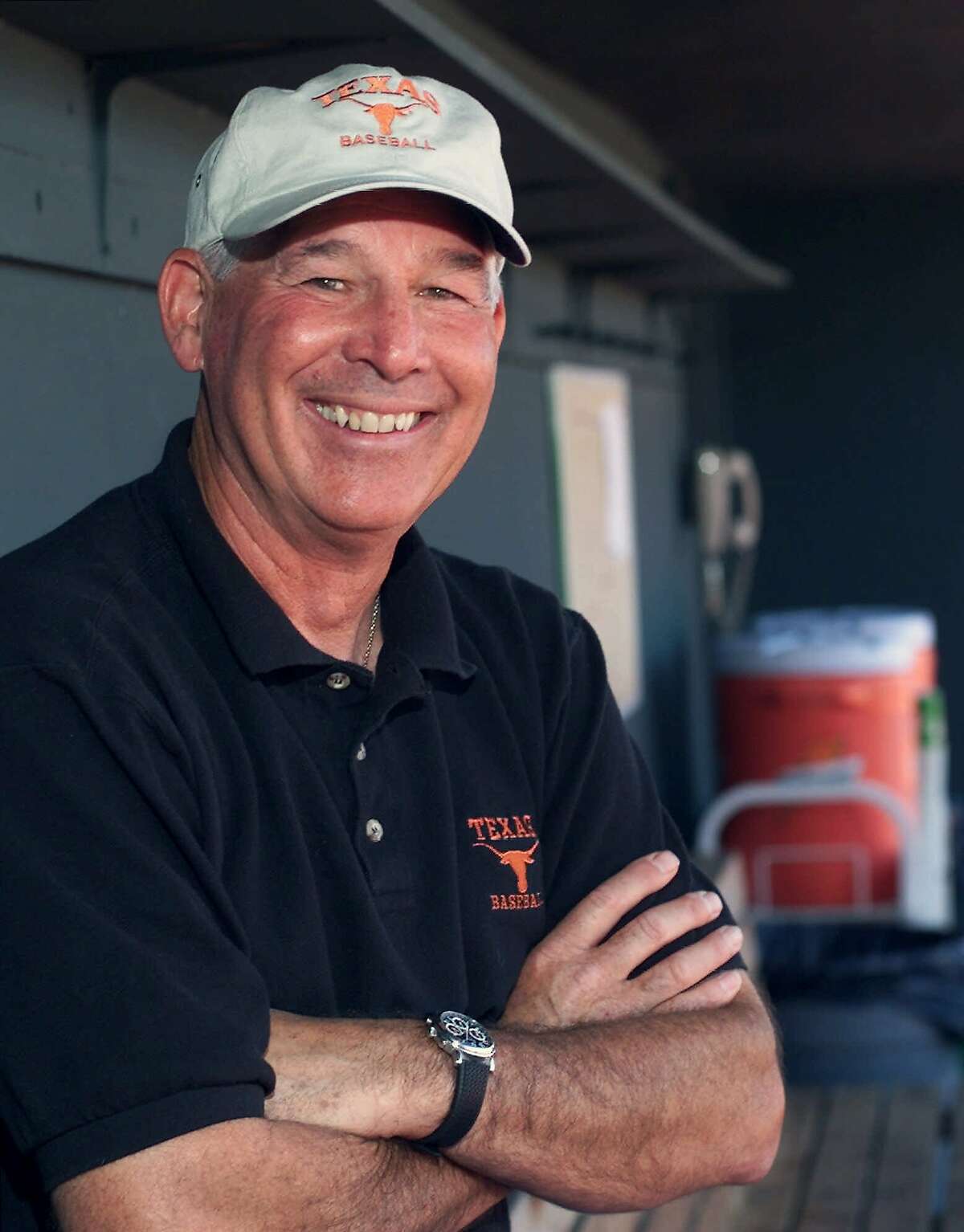 University of Texas head baseball coach Augie Garrido is shown in the team's home dugout on Wednesday, March 29, 2000, in Austin, Texas. Garrido is in his fourth season at Texas. (AP Photo/Harry Cabluck)