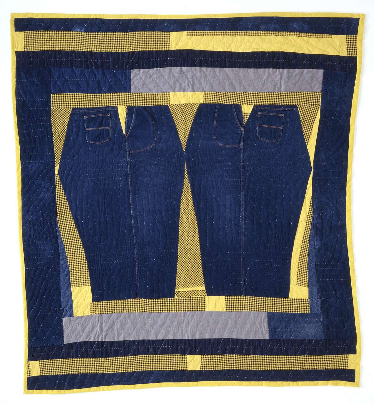 Discarded denim was pieced by Arbie Williams into "Mamaloo," which was also quilted by Willia Ette Graham and Johnnie Alberta Wade. The 1992 denim and cotton flannel quilt from the collection of Eli Leon appears in "Yo-Yos & Half Squares: Contemporary California Quilts" at Oakland Museum of California from Sept. 12-Feb. 21. Credit: Oakland Museum of Caifornia
