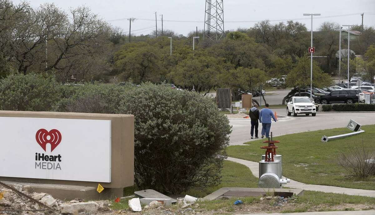A Houston bankruptcy judge confirmed San Antonio-based iHeartMedia Inc.’s bankruptcy reorganization plan Tuesday. The company is shedding more than $10 billion in debt as part of the plan. Pictured are people walking near IHeart’s headquarters on the North Side in March.