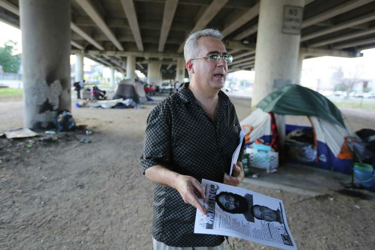 George Ruano hands out fliers including pictures and information about his missing brother underneath US 59 between Caroline and La Branch streets, Thursday, Jan. 12, 2017, in Houston. Ruano has been searching for his brother, Daniel Almendi, who suffers from schizophrenia, since Daniel was released from the Harris County Psychiatric Center on Nov. 30, 2016. ( Mark Mulligan / Houston Chronicle )