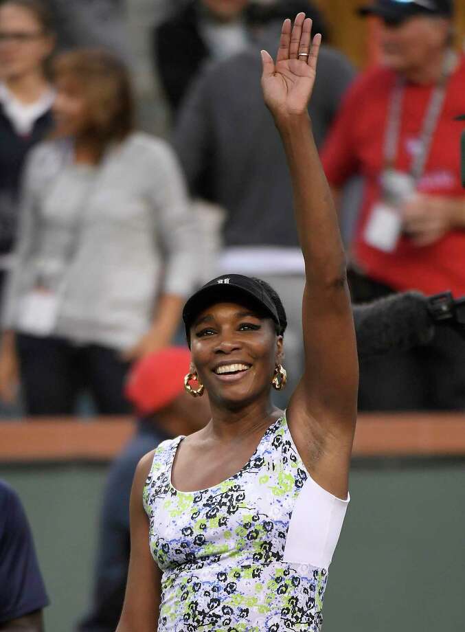 Venus Williams waves after defeatting Carla Suarez Navarro, of Spain, during the quarterfinals at the BNP Paribas Open tennis tournament, Thursday, March 15, 2018, in Indian Wells, Calif. (AP Photo/Mark J. Terrill) Photo: Mark J. Terrill / Copyright 2018 The Associated Press. All rights reserved.