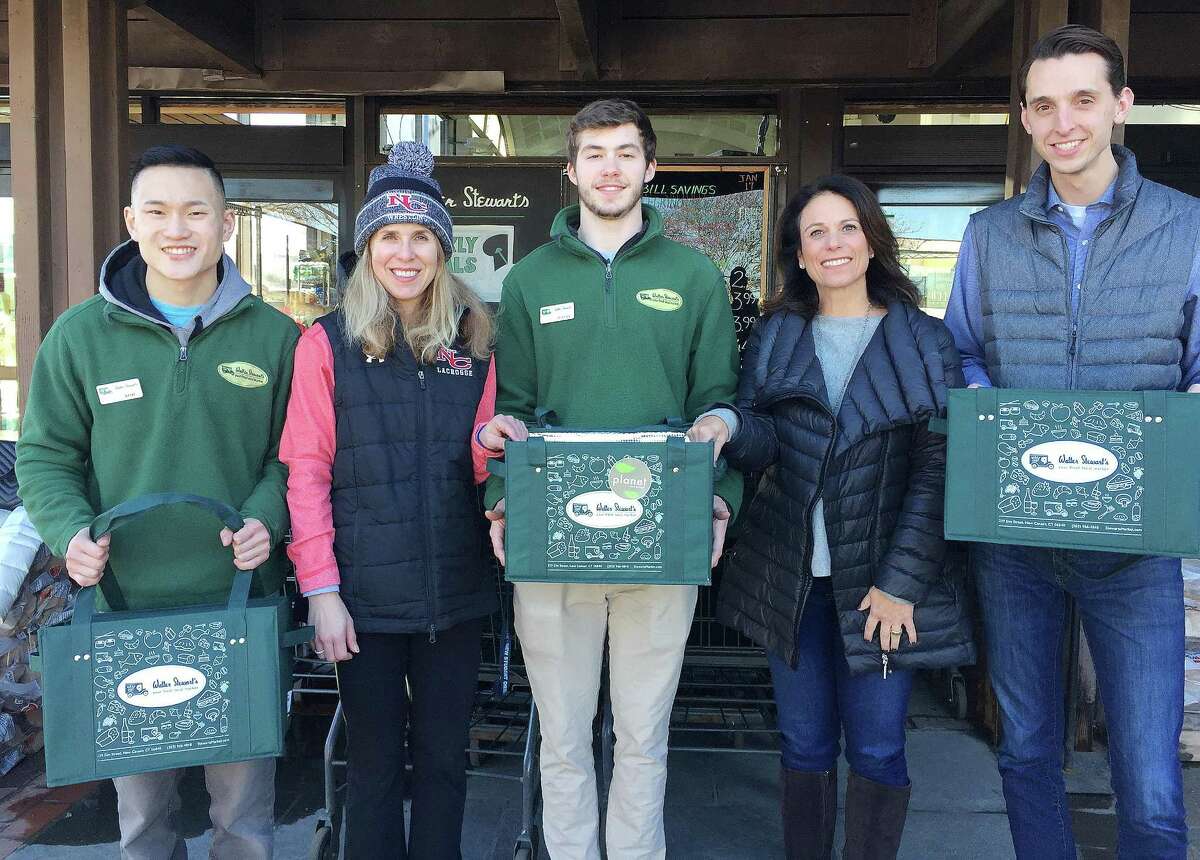 Stewart's Market and Planet New Canaan teamed up to promote the use of reusable bags and support The New Canaan All Sports Booster Club. From left: Rob Zimmerman, Kathy Bucci, Justin Graff, Elissa Mellinger and CJ Heron.