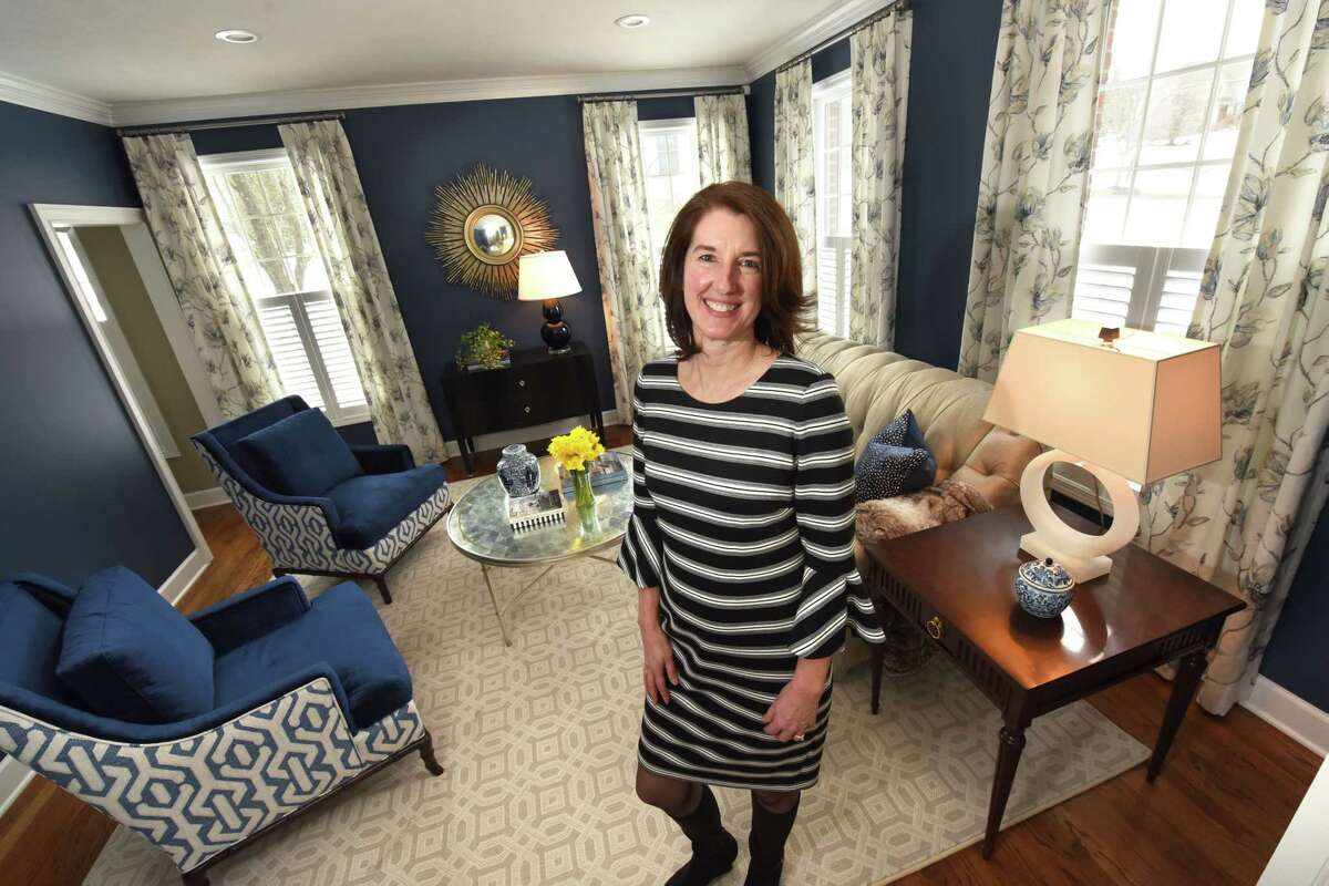 Meghan Baltich, the grand prize winner in a home design contest, stands in the winning room which is a living room in Traci and Joseph Roberto's home on Monday, March 12, 2018 in Loudonville, N.Y. (Lori Van Buren/Times Union)