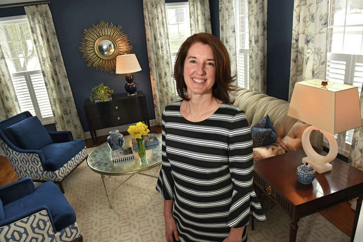 Meghan Baltich, the grand prize winner in a home design contest, stands in the winning room which is a living room in Traci and Joseph Roberto's home on Monday, March 12, 2018 in Loudonville, N.Y. (Lori Van Buren/Times Union)