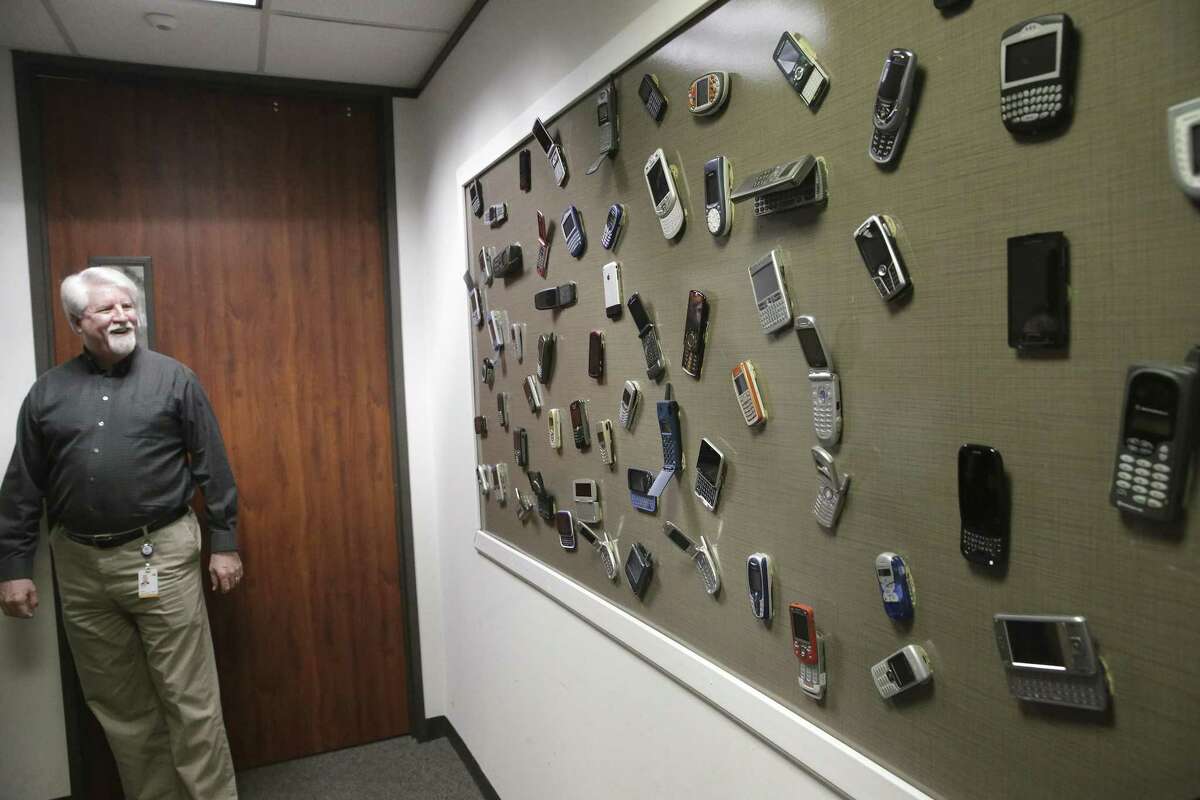 Dave Wolter, assistant vice president of radio technology and strategy at AT&T, shows off a display board of old phones at AT&T's Austin 5G lab. The 5G technology, shorthand for the fifth generation of wireless networks, is the next step in building a critical infrastructure to power the future “Internet of Things” where everyday household items are all connected to the Internet.
