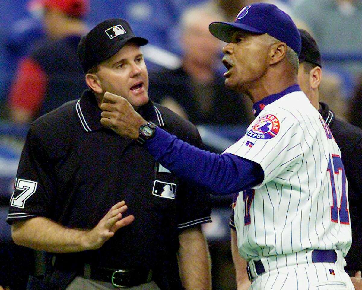 San Francisco Giants' new right fielder Moises Alou, left, listens to his  father, Giants' manager Felipe Alou, right, during spring training at  Scottsdale Stadium in Scottsdale, Ariz., Wednesday Feb. 23, 2005. .(AP