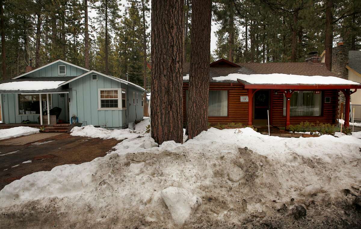 Two homes in the Al Tahoe neighborhood on Sun. March 11, 2018, in South Lake Tahoe, Calif. The home on the left is a residential home while the one on the right is a rental, with the homes so close together in the neighborhood, calls from residents with noise complaints have come from around the neighborhood. The City of South Lake Tahoe has a strict Vacation Home Rental Ordinance (VHR) with fines of $1,000 for violations.