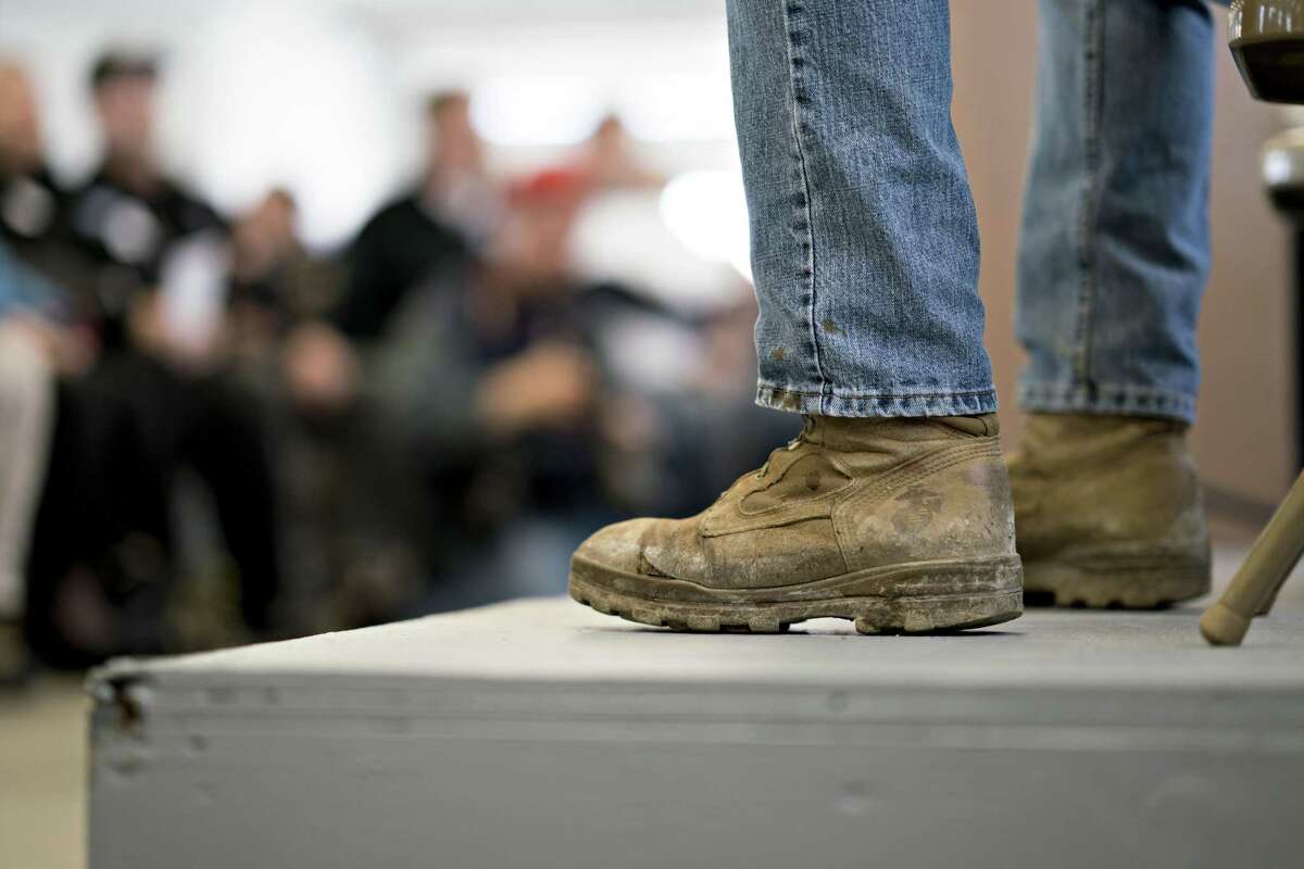 Conor Lamb, Democratic candidate for the U.S. House of Representatives, wears U.S. Marine branded boots during a campaign rally with members of the United Mine Workers of America (UMWA) at the Greene County Fairgrounds in Waynesburg, Pennsylvania, U.S., on Sunday, March 11, 2018. Lamb is locked into a tight race with Republican state representative Rick Saccone ahead of a March 13 special election for a U.S. House seat in southwest Pennsylvanias 18th congressional district seat that was vacated by Republican Tim Murphy following a sexual harassment scandal. Photographer: Andrew Harrer/Bloomberg