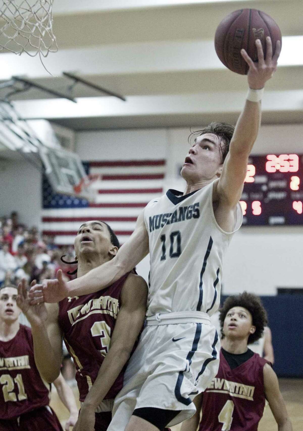 Immaculate High School's Quinn Guth rises for a shot in the Division II boys basketball quarterfinals against New Britain High School, played at Immaculate. Monday, March 12, 2018