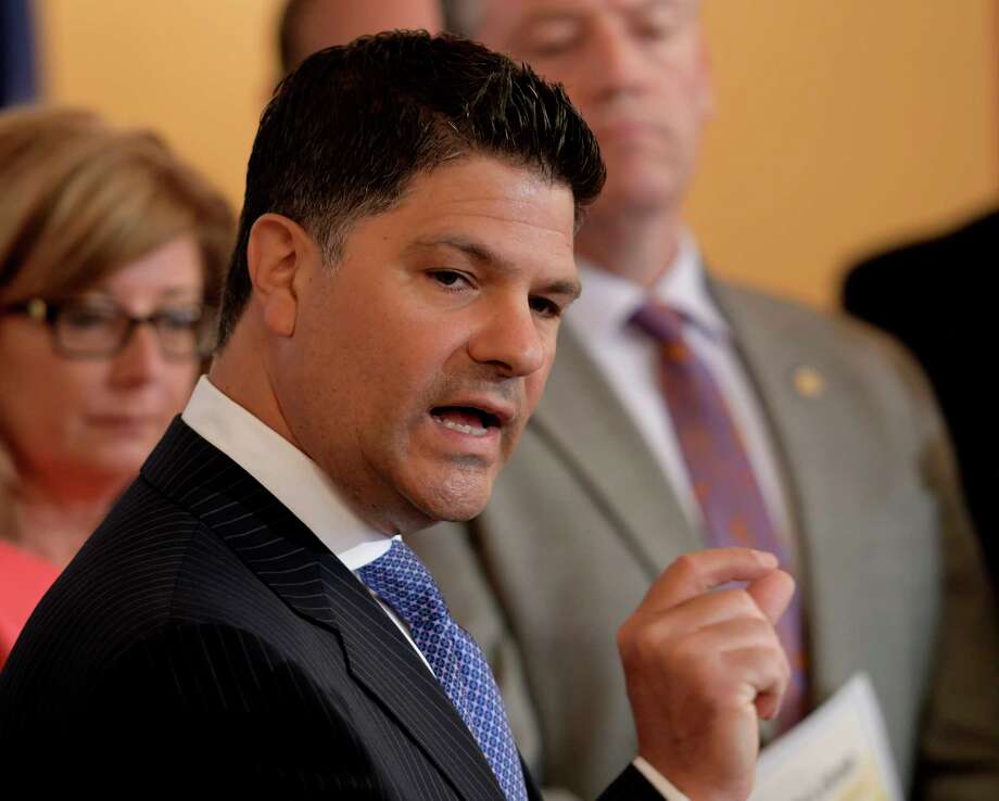 Senator George Amedore, (R-R-I, Rotterdam) Co-Chair of the task force is surrounded by members of the Senate and of the NYS Joint Task Force on Heroin and Opioid Addiction during a press conference to announce the next steps being taken to help end the state's heroin, opioid and synthetic drug epidemic Tuesday June 13, 2017 at the State Capitol in Albany, N.Y.  (Skip Dickstein/Times Union) Photo: SKIP DICKSTEIN / 40040763A