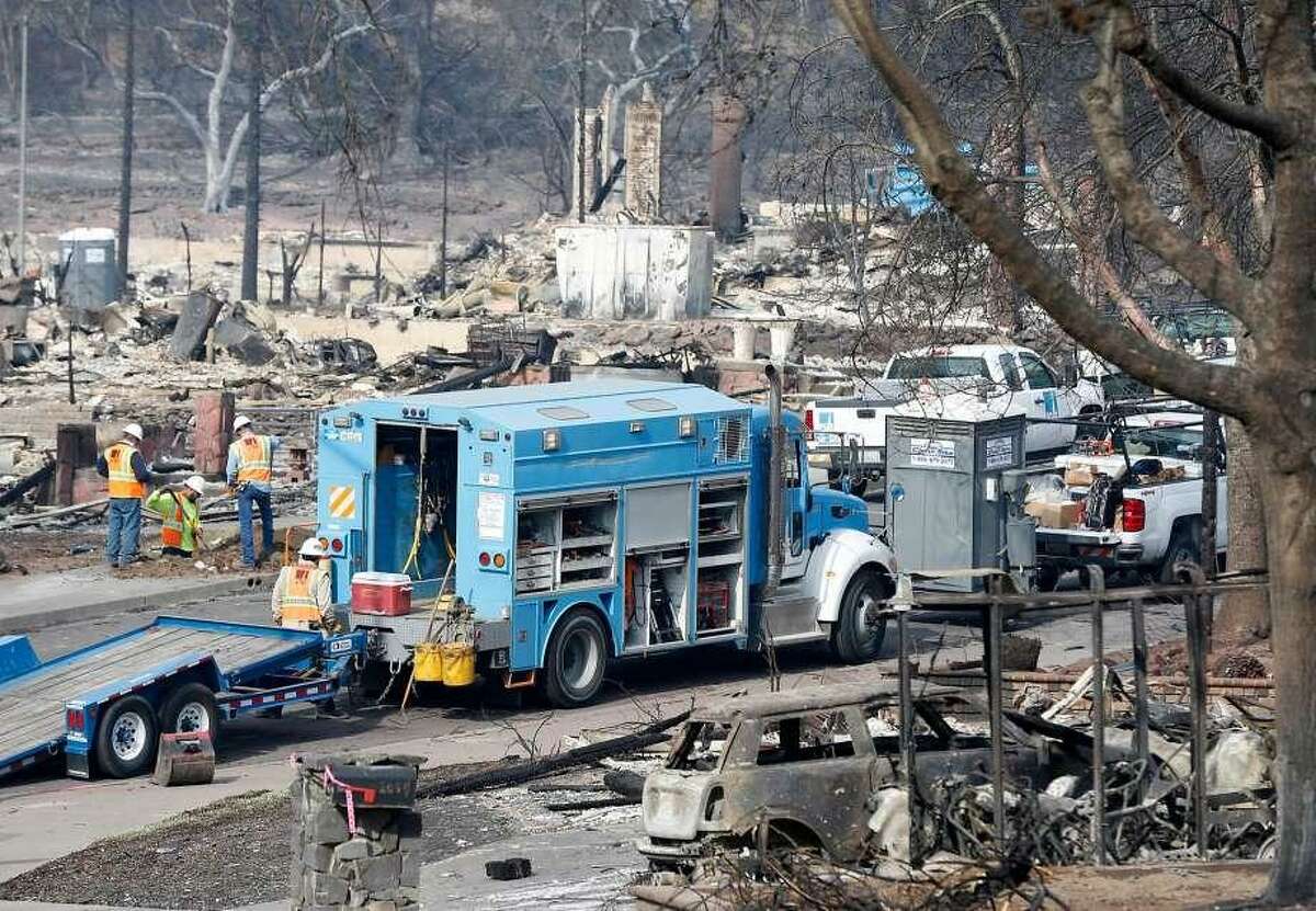 PG&E crews work on Vintage Circle in the heart of in the Fountaingrove neighborhood, destroyed by the Tubbs Fire, in Santa Rosa, Calif. on Tuesday Oct. 17, 2017.