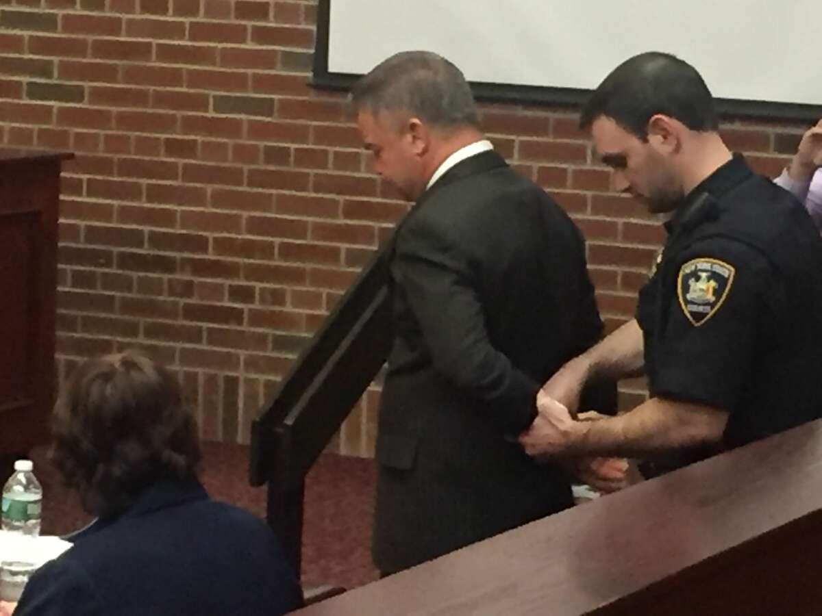 John W. Cole is handcuffed after being convicted of felony assault and alcohol-impaired driving in Saratoga County Court in Ballston Spa on March 16, 2018.