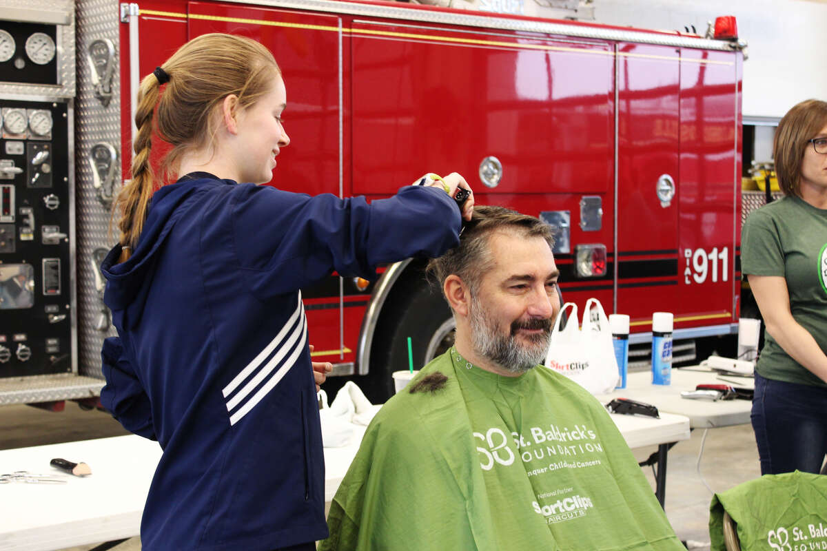 John Roberts, of Glen Carbon, was one of the volunteers to shave his head for the St. Baldrick's fundraiser on Saturday, hosted by the Edwardsville Fire Department.