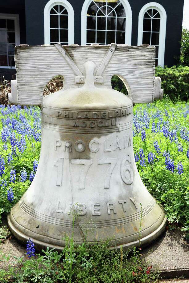 the liberty bell in front of the insurance agency looks like a