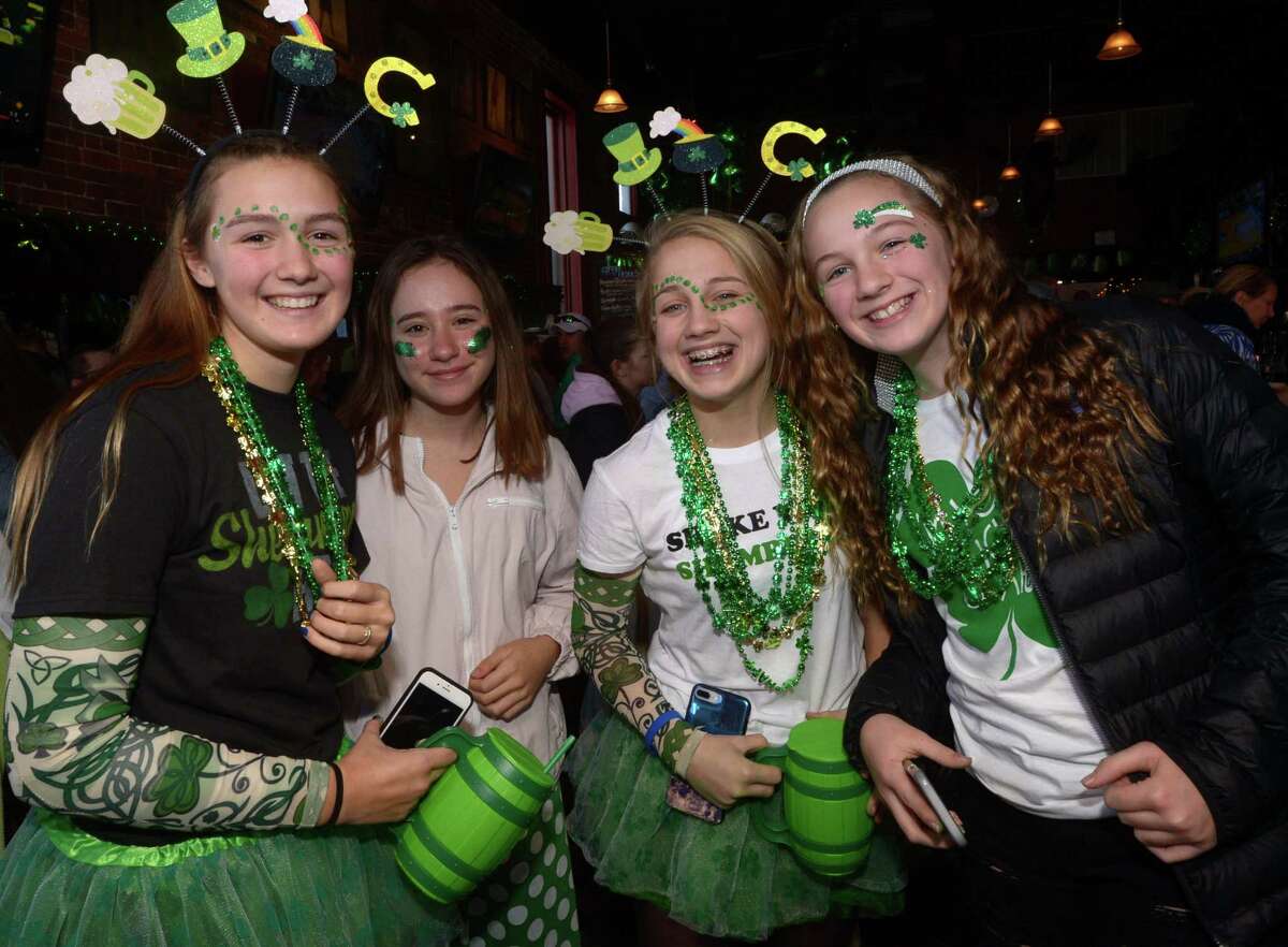 Revelers take part in a St. Patrick's Day celebration at Donovan's restaurant Saturday, March 17, 2018, in Norwalk, Conn.