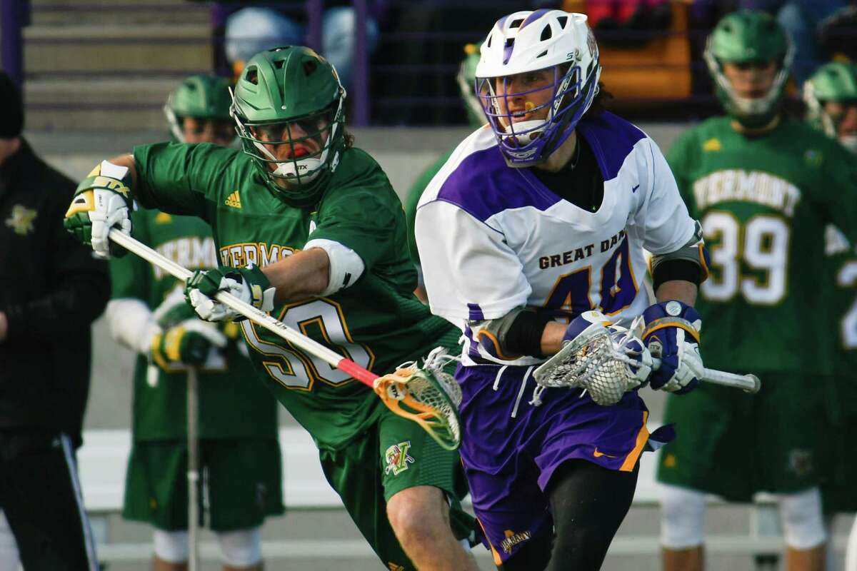 Vermont's James Leary stick checks UAlbany's AJ Kluck as he drives with the ball during a game at Casey Stadium on Saturday, Mar. 17, 2018, in Albany, N.Y. (Jenn March, Special to the Times Union)