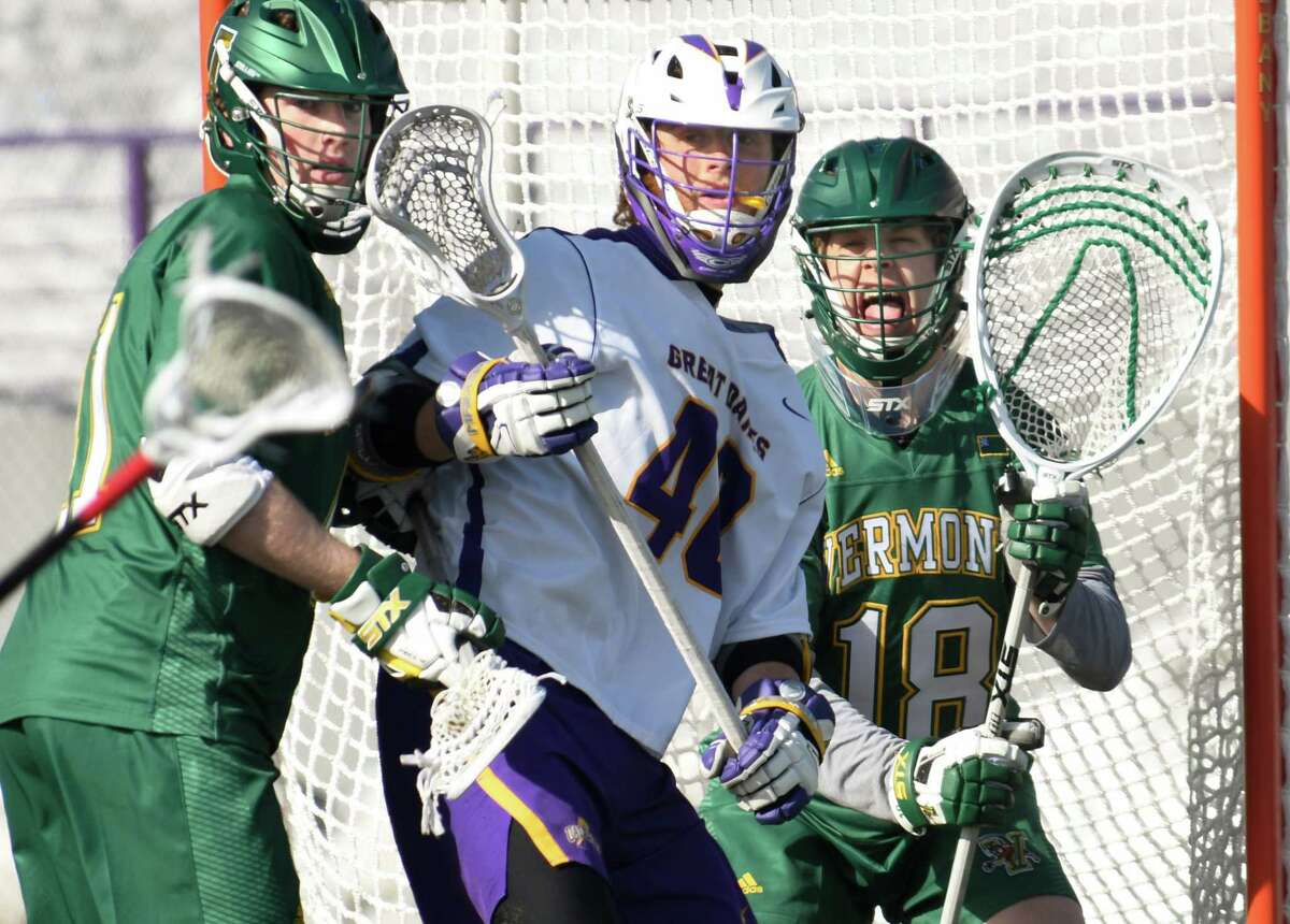 Vermont goalie Nick Washuta yells to teammates as a Vermont defender guards UAlbany's Kyle McClancy during a game at Casey Stadium on Saturday, Mar. 17, 2018, in Albany, N.Y. (Jenn March, Special to the Times Union)