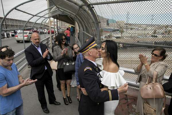 Retired chief warrant officer Dave Williams kisses his bride, Lourdes Carreón.