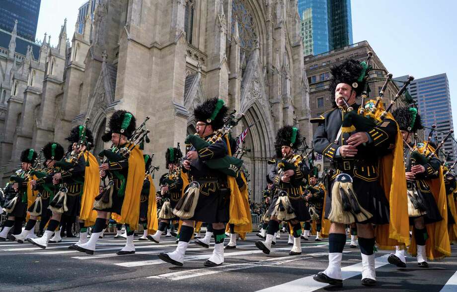 Bagpipers with the NYPD Emerald Society walks past St. Patrick's Cathedral as they take part in the St. Patrick's Day parade Saturday, March 17, 2018, in New York.  Irish Prime Minister Leo Varadkar joined along as Manhattan's Fifth Avenue came alive with the sound of bagpipes, trumpets and lots of green during the 257th running of the parade.  (AP Photo/Craig Ruttle) Photo: Craig Ruttle / FR61802 AP
