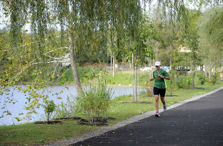 A runner uses the Young's Field Riverwalk in New Milford on Friday, Oct. 13, 2017. Photo: Carol Kaliff / Hearst Connecticut Media / The News-Times
