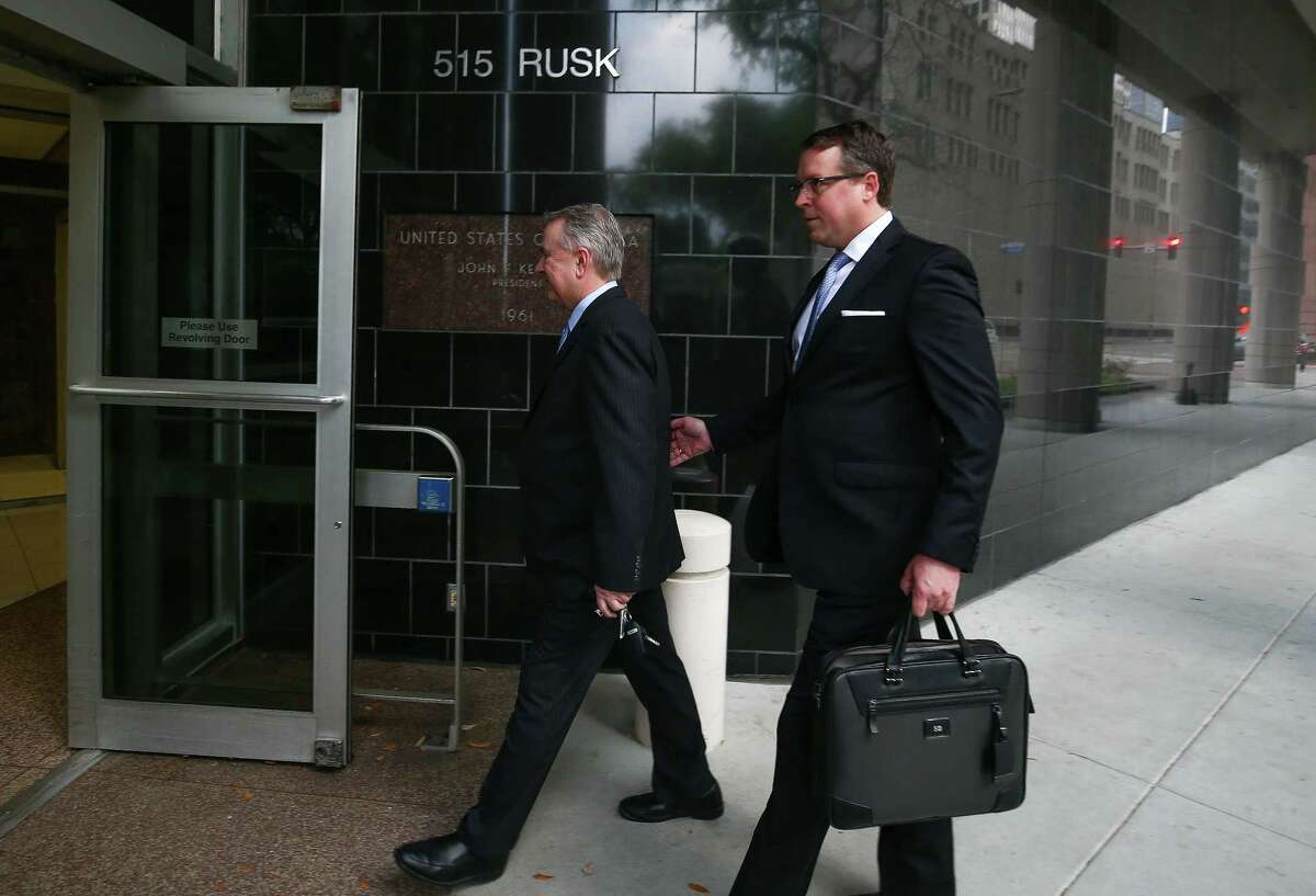 Former U.S. Congressman Steve Stockman, left, and his attorney Sean Buckley walk into the Federal Courthouse for the start of federal corruption trial against Stockman Monday, March 19, 2018, in Houston.